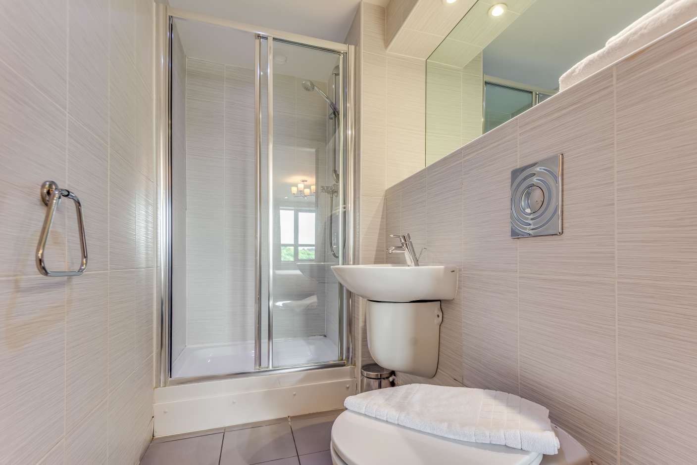 En-suite bathroom with walk in shower, toilet and The White Company toiletries